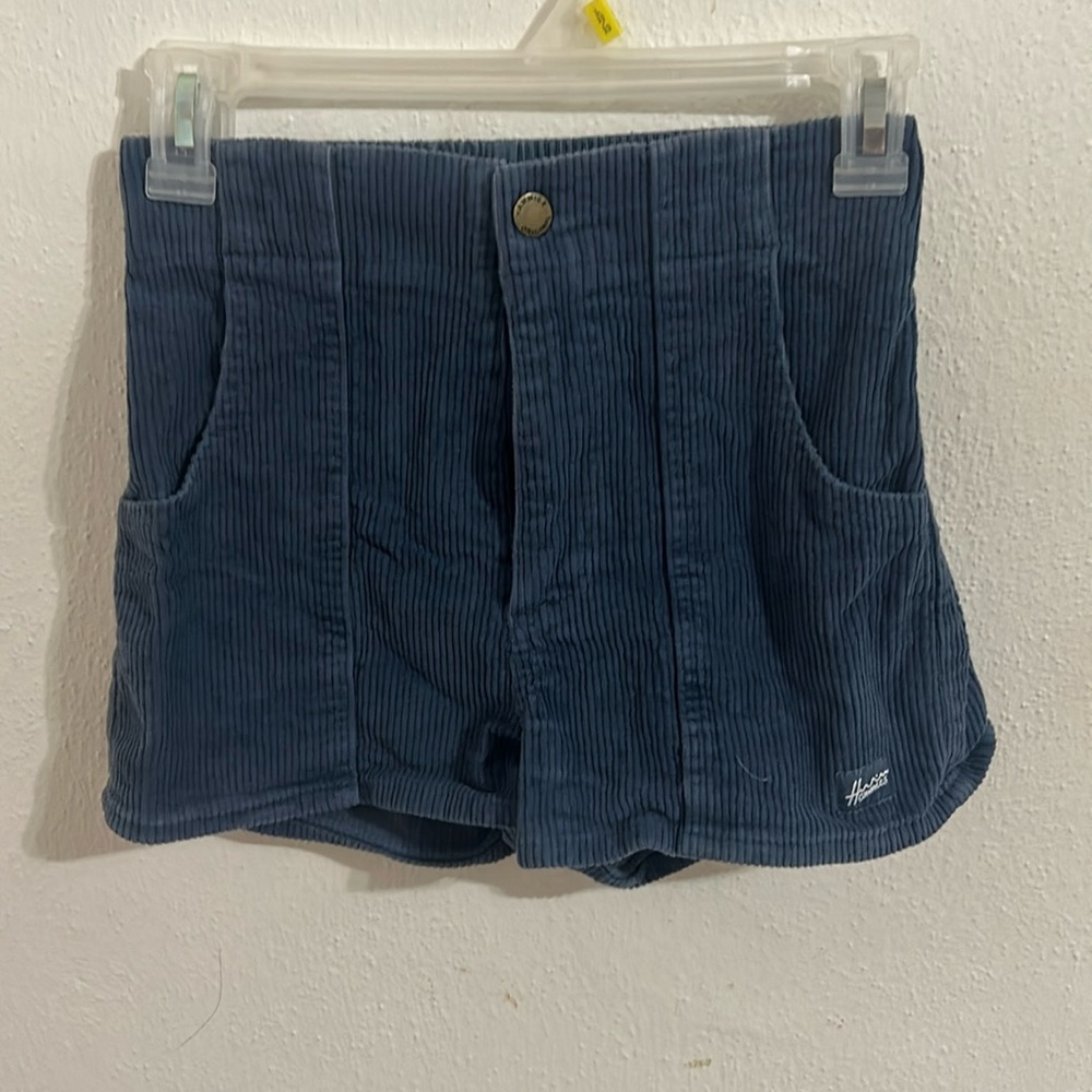 dark blue high waisted corduroy shorts.